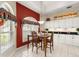 Bright dining area featuring an adjacent buffet and hutch and a wooden dining table with seating for four at 1010 Sierra Blanca Ct, Lady Lake, FL 32159