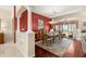 Elegant dining room featuring stylish decor, wood floors, decorative columns, and sliding glass doors at 1010 Sierra Blanca Ct, Lady Lake, FL 32159