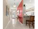 Bright foyer boasts tile flooring, decorative lighting, and an accent wall for a grand entrance at 1010 Sierra Blanca Ct, Lady Lake, FL 32159