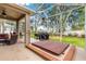 Enclosed patio features a hot tub and grill, perfect for outdoor living and entertaining at 1010 Sierra Blanca Ct, Lady Lake, FL 32159