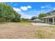 Generously sized backyard features a sports court with basketball hoop and large patio at 107 Wekiva Pointe Cir, Apopka, FL 32712