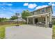 Large backyard featuring covered patio, sport court with basketball hoop and a fenced yard at 107 Wekiva Pointe Cir, Apopka, FL 32712