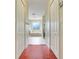 Hallway leading to a spacious bathroom with a tub and shower at 107 Wekiva Pointe Cir, Apopka, FL 32712