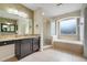 Bathroom featuring a granite countertop vanity, glass shower, and garden tub at 107 Wekiva Pointe Cir, Apopka, FL 32712