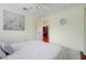 Bedroom with hardwood flooring, large window, ceiling fan and access to a second room at 107 Wekiva Pointe Cir, Apopka, FL 32712