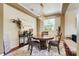 Cozy dining room with a wooden table and chairs, perfect for Gathering meals and gatherings at 107 Wekiva Pointe Cir, Apopka, FL 32712