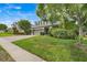 Charming two-story home with a three-car garage, brick driveway and lush landscaping at 107 Wekiva Pointe Cir, Apopka, FL 32712