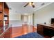 Spacious office area with built in shelving, hardwood floors, and great natural lighting at 107 Wekiva Pointe Cir, Apopka, FL 32712