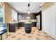 Stylish kitchen with dark cabinetry, stainless steel appliances, and a functional center island at 107 Wekiva Pointe Cir, Apopka, FL 32712