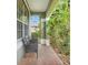 Cozy front porch with seating area, perfect for relaxing and enjoying the outdoors at 107 Wekiva Pointe Cir, Apopka, FL 32712
