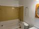 Bathroom featuring a shower and tub combination, and a mirror at 1109 Willow Ct, Tavares, FL 32778