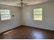 Spacious bedroom featuring wood-look flooring and a neutral color palette at 1109 Willow Ct, Tavares, FL 32778