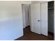 Bedroom with wood-look floors featuring an open closet, and light paint at 1109 Willow Ct, Tavares, FL 32778