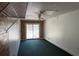 Bonus room with carpet, brick accents and a sliding glass door at 1109 Willow Ct, Tavares, FL 32778