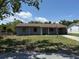 Charming single-story home with a well-maintained lawn and classic architectural design at 1109 Willow Ct, Tavares, FL 32778