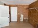 Utility Room featuring faux brick walls and a utility sink at 1109 Willow Ct, Tavares, FL 32778