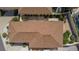 Overhead aerial view of the home's new roof, back patio, and lush landscaping at 1116 San Bernardo Rd, The Villages, FL 32162
