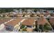 An aerial view of neighborhood homes and manicured landscaping with mature trees at 1116 San Bernardo Rd, The Villages, FL 32162