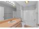 Bathroom with a shower and bathtub featuring neutral colors throughout at 1116 San Bernardo Rd, The Villages, FL 32162