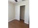 Bedroom featuring wood floors and closet with sliding door at 1116 San Bernardo Rd, The Villages, FL 32162
