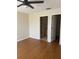 Bedroom boasts wood floors with easy access to bathroom and closet at 1116 San Bernardo Rd, The Villages, FL 32162