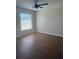 Bright bedroom with ample light and wood flooring at 1116 San Bernardo Rd, The Villages, FL 32162