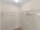 Walk-in closet offers ample storage space for clothing and accessories at 1116 San Bernardo Rd, The Villages, FL 32162