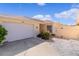 Single Gathering home featuring an attached two-car garage, mature landscaping, and white rock at 1116 San Bernardo Rd, The Villages, FL 32162