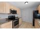 Eat-in kitchen with granite countertops and stainless steel appliances, perfect for cooking at 1116 San Bernardo Rd, The Villages, FL 32162