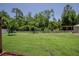 A backyard with a pergola and a white picket fence at 11418 Lake Eustis Dr, Leesburg, FL 34788
