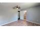 The Primary bedroom is spacious with neutral walls and features a doorway that leads to an attached bathroom at 11418 Lake Eustis Dr, Leesburg, FL 34788