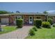 Charming front entrance with a brick walkway and covered porch at 11418 Lake Eustis Dr, Leesburg, FL 34788