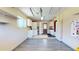 Spacious garage with laundry area, cabinets, and shelving for organized storage and utility at 11418 Lake Eustis Dr, Leesburg, FL 34788
