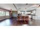 The expansive kitchen island offers seating and counter space, complemented by stainless appliances and stone accent wall at 11418 Lake Eustis Dr, Leesburg, FL 34788