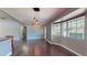 Spacious living room with hardwood floors, ample natural light, and open floor plan at 11418 Lake Eustis Dr, Leesburg, FL 34788