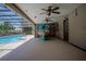 Screened-in pool area with bar, offering a perfect blend of relaxation and entertainment at 11418 Lake Eustis Dr, Leesburg, FL 34788