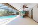 A screened-in pool with a boat at 11418 Lake Eustis Dr, Leesburg, FL 34788