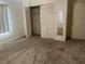 Bedroom featuring carpet and closet with sliding doors for storage at 11812 Watts Ct, Tavares, FL 32778