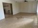 Spacious living room with tile flooring, a ceiling fan, and an open layout, leading to other rooms at 11812 Watts Ct, Tavares, FL 32778