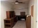 Home office featuring a built-in desk and shelves, providing ample storage and workspace at 11812 Watts Ct, Tavares, FL 32778