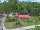 Aerial view of a well-maintained single-story home with fenced yard and metal roof at 12288 Sw 35Th Dr, Webster, FL 33597