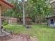 Large backyard offers sheds, gazebos and other structures perfect for outdoor enjoyment at 12288 Sw 35Th Dr, Webster, FL 33597