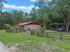 Charming single story home with a fenced yard and metal carport at 12288 Sw 35Th Dr, Webster, FL 33597