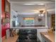 Open-concept kitchen with electric range, connecting to the living room for easy entertaining at 12288 Sw 35Th Dr, Webster, FL 33597