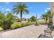 Backyard brick patio with tropical landscaping, perfect for outdoor living and relaxation at 1376 Birdsong Pl, The Villages, FL 32163