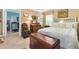 Well-lit bedroom with comfortable bed, dresser with mirror, and bright natural light at 1376 Birdsong Pl, The Villages, FL 32163