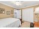 Cozy bedroom featuring a bed, a double door closet, and bright natural light at 1376 Birdsong Pl, The Villages, FL 32163