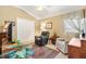 Bonus room featuring two chairs, a double door closet, an area rug and lots of natural light at 1376 Birdsong Pl, The Villages, FL 32163