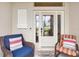 Cozy front porch with seating, a decorative door, and a welcoming atmosphere at 1376 Birdsong Pl, The Villages, FL 32163