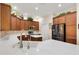 Well-equipped kitchen with wood cabinets, stainless steel appliances, and bright countertops at 1376 Birdsong Pl, The Villages, FL 32163